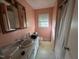 Pink bathroom with sink, toilet and shower/tub at 291 Knight, Broadway, NC 27505