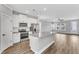 Modern kitchen featuring stainless steel appliances and white cabinetry at 300 Brickwell Way, Youngsville, NC 27596