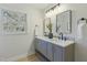 Double vanity bathroom with marble countertop and gray cabinets at 305 Edgewater Dr, Broadway, NC 27505