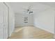 Spacious bedroom featuring a window, ceiling fan and light wood laminate flooring at 305 Edgewater Dr, Broadway, NC 27505