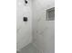 Walk-in shower with marble tile and hexagon floor tile at 305 Edgewater Dr, Broadway, NC 27505