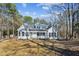 Newly renovated home with a large yard and wooden fence at 309 Monterey Ct, Benson, NC 27504
