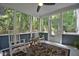 Spacious screened porch overlooking a wooded backyard at 340 Andrews Store Rd, Pittsboro, NC 27312