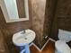 Small bathroom with pedestal sink and toilet at 5503 Silver Moon, Raleigh, NC 27606