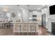 Modern kitchen with white cabinets, island, and stainless steel appliances at 5516 Wallace Martin Way, Raleigh, NC 27616