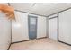 Small bedroom with window, closet, and wood paneling at 60 Stone Place Rd, Dunn, NC 28334