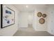 Upstairs hallway with neutral wall decor and carpet at 103 Reagan Crest Dr, Clayton, NC 27520