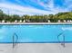 Community swimming pool with lounge chairs and a playground at 1048 Fairhaven Dr # 99, Mebane, NC 27302