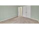 Simple bedroom with light walls and neutral carpeting at 105 Mercia Cir, Durham, NC 27703