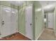 Bright entryway with light green walls and wood flooring at 105 Mercia Cir, Durham, NC 27703