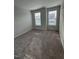 Bright bedroom with carpet and large windows at 1055 Westerland Way # 37, Durham, NC 27703