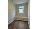 Small bedroom with hardwood floors and a window with a view at 1055 Westerland Way # 37, Durham, NC 27703