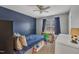 Smaller bedroom with a blue accent wall and built-in storage at 109 Feezor Ct, Clayton, NC 27527