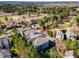 Aerial view of a community with houses, trees, and a golf course at 1231 Kelton Cottage Way, Morrisville, NC 27560