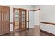 Bright hallway with French doors and hardwood floors at 1231 Kelton Cottage Way, Morrisville, NC 27560