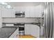 Modern kitchen with stainless steel appliances and granite countertops at 1231 Kelton Cottage Way, Morrisville, NC 27560