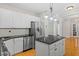 Modern kitchen with stainless steel appliances and granite countertops at 1231 Kelton Cottage Way, Morrisville, NC 27560