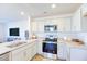 Modern kitchen with granite countertops and stainless steel appliances at 137 Holton St, Smithfield, NC 27577