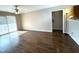 Living room with hardwood floors and access to a balcony at 1950 Trailwood Heights Ln, Raleigh, NC 27603