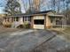 Brick ranch house with attached carport at 204 Hemlock Dr, Durham, NC 27705