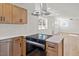 Modern kitchen with light wood cabinets, quartz countertops, and stainless steel appliances at 207 Cloverdale Dr, Smithfield, NC 27577