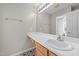 Bathroom with single vanity and wood cabinets at 27 Gray Ghost St, Benson, NC 27504