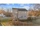 Two-story house with light brown siding, deck, and fenced backyard at 27 Gray Ghost St, Benson, NC 27504