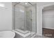 Spa-like bathroom with a walk-in shower and built-in seat at 409 Reinsman Ct, Mebane, NC 27302