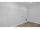 Laundry room with ample shelving and vinyl flooring at 409 Reinsman Ct, Mebane, NC 27302