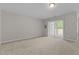 Spacious recreation room with access to backyard patio at 5147 Sandy Banks Rd, Raleigh, NC 27616