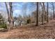 House exterior view from wooded area at 52302 Fowle, Chapel Hill, NC 27517