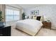 Bright bedroom with large window, neutral walls, and carpeted floor at 5512 Henley Ridge Dr # 191, Graham, NC 27253