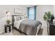 Cozy bedroom featuring a gray comforter and modern decor at 5512 Henley Ridge Dr # 191, Graham, NC 27253