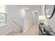 Upstairs hallway with neutral decor, carpet flooring, and access to bedrooms at 5512 Henley Ridge Dr # 191, Graham, NC 27253