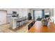 Open concept kitchen with island, granite countertops, stainless steel appliances and hardwood floors at 5512 Henley Ridge Dr # 191, Graham, NC 27253