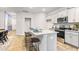 Eat-in kitchen with island, granite countertops, stainless steel appliances, and hardwood floors at 5512 Henley Ridge Dr # 191, Graham, NC 27253