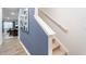 Modern staircase with blue accent wall at 5512 Henley Ridge Dr # 191, Graham, NC 27253