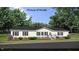 Single-story home with a neutral color palette and landscaping at 6016 Charlies Deadend Rd, Efland, NC 27243