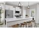 Modern kitchen with white cabinets, stainless steel appliances, and an island at 6334 Lady Eliza Ln, Raleigh, NC 27610