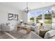 Spacious living room with light-colored furniture, a large window, and a coffee table at 6334 Lady Eliza Ln, Raleigh, NC 27610