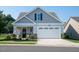 Two-story house with gray siding, white trim, and a two-car garage at 701 Cherry Tree Dr, Mebane, NC 27302