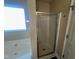 Clean bathroom with a shower stall and glass enclosure at 7041 Spanglers Spring Way, Raleigh, NC 27610