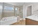 Main bathroom with a garden tub and double sinks at 7925 Hartham Park Ave, Raleigh, NC 27616