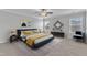 Spacious bedroom with a plush bed and ample natural light at 7925 Hartham Park Ave, Raleigh, NC 27616