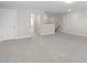 Large bonus room with carpeted floor and multiple doors at 1129 Capulet Dr, Burlington, NC 27215