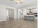 Open concept kitchen with gray island and white cabinets at 1129 Capulet Dr, Burlington, NC 27215