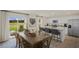 Bright dining area with kitchen and sliding glass doors to backyard at 113 Reagan Crest Dr, Clayton, NC 27520