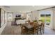 Open dining room with wood table and access to the kitchen and patio at 113 Reagan Crest Dr, Clayton, NC 27520
