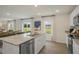 Spacious kitchen with granite countertops, white cabinets, and stainless steel appliances at 113 Reagan Crest Dr, Clayton, NC 27520