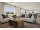 Open living room with a comfortable seating area and large windows at 113 Reagan Crest Dr, Clayton, NC 27520